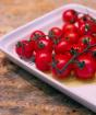 Hvordan sylte cherrytomater i glass for vinteren